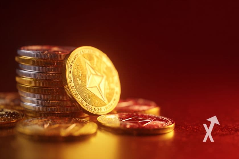 coins empliés avec un coin Ethereum en jaune posé debout sur un fond rouge